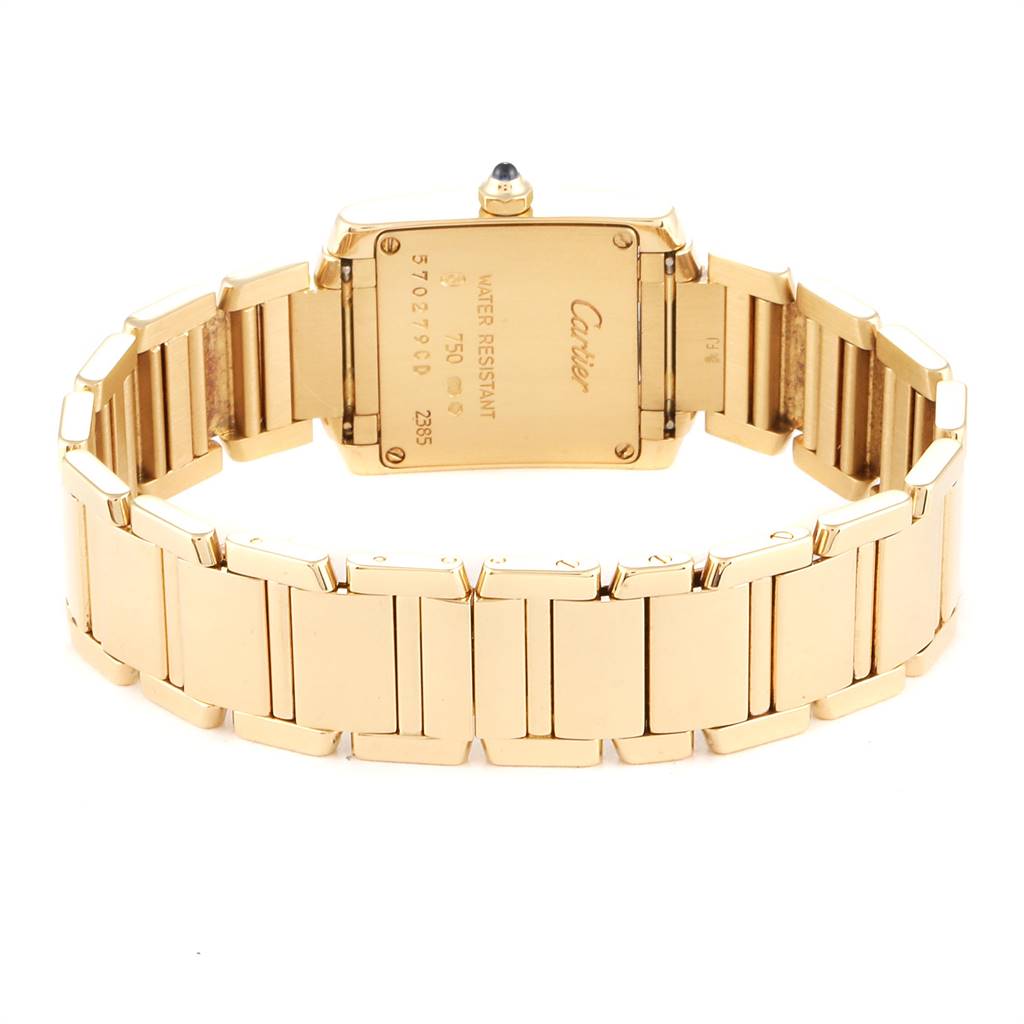 The image shows the back view of the Cartier Tank Française watch, highlighting its rectangular case and metal bracelet.