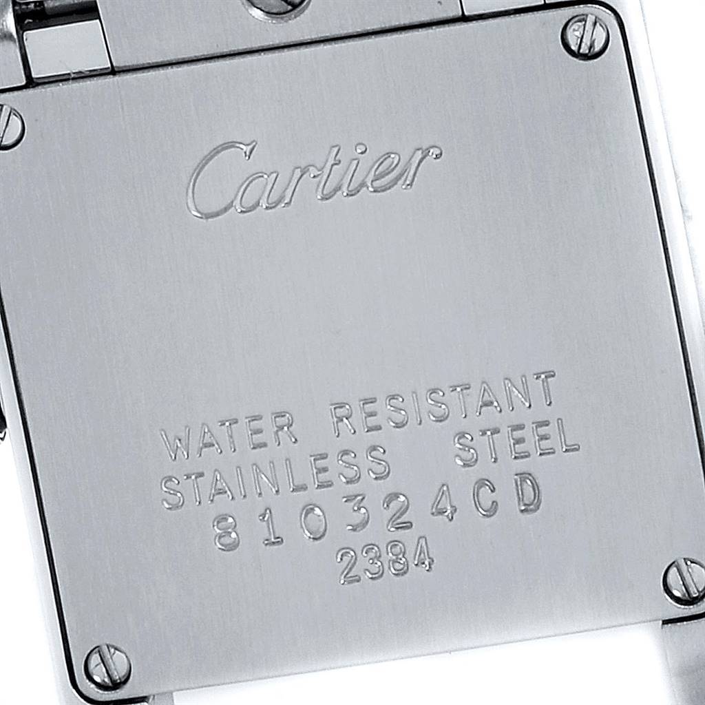 The image shows the back case of a Cartier Tank Francaise W51007Q4 Women's Steel and Gold (two tone) Silver Dial W51007Q4 Women's Steel and Gold (two tone) Silver Dial watch, featuring engraved branding and details.