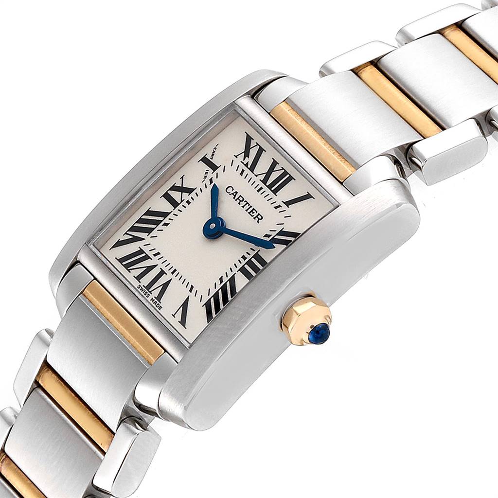 The image shows a close-up angle of the Cartier Tank Française watch, highlighting its face, crown, and part of the two-tone bracelet.