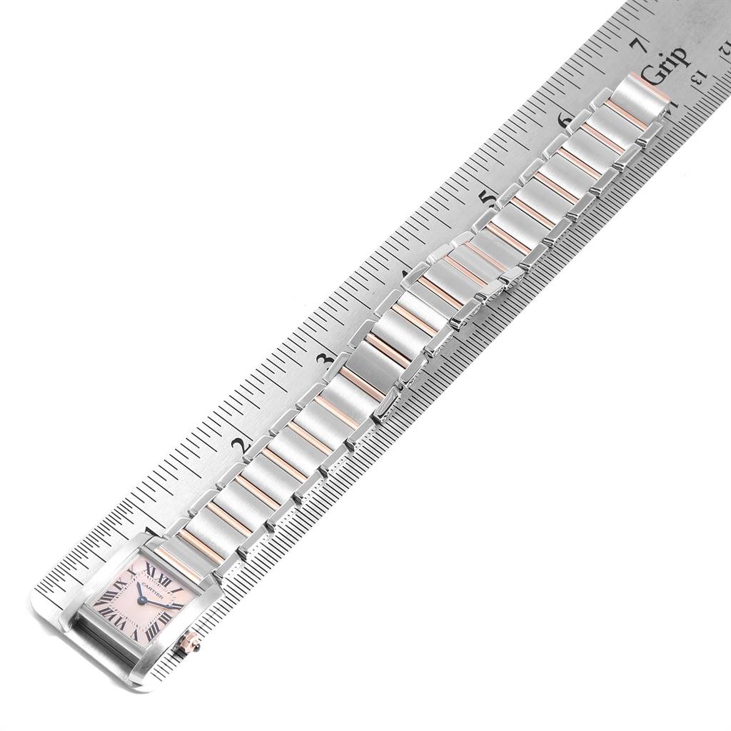 The Cartier Tank Francaise W51027Q4 Women's Steel and Gold (two tone) Mother of Pearl Dial W51027Q4 Women's Steel and Gold (two tone) Mother of Pearl Dial watch is shown at an angle from the side, with its full bracelet laid flat along a ruler.