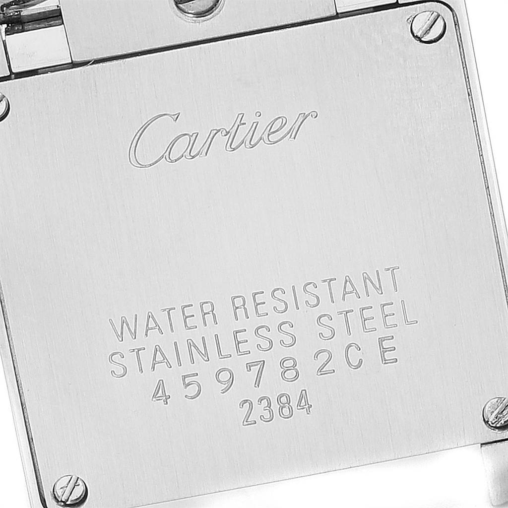 This image shows the back casing of a Cartier Tank Française watch, highlighting its water resistance and stainless steel markings.
