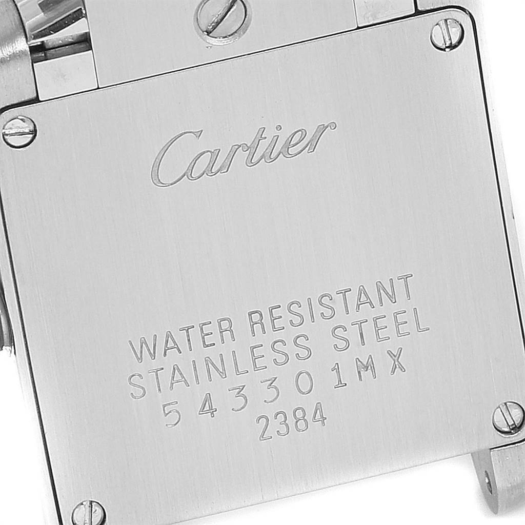 This is a close-up of the Tank Francaise Cartier watch's stainless steel case back displaying its engravings.