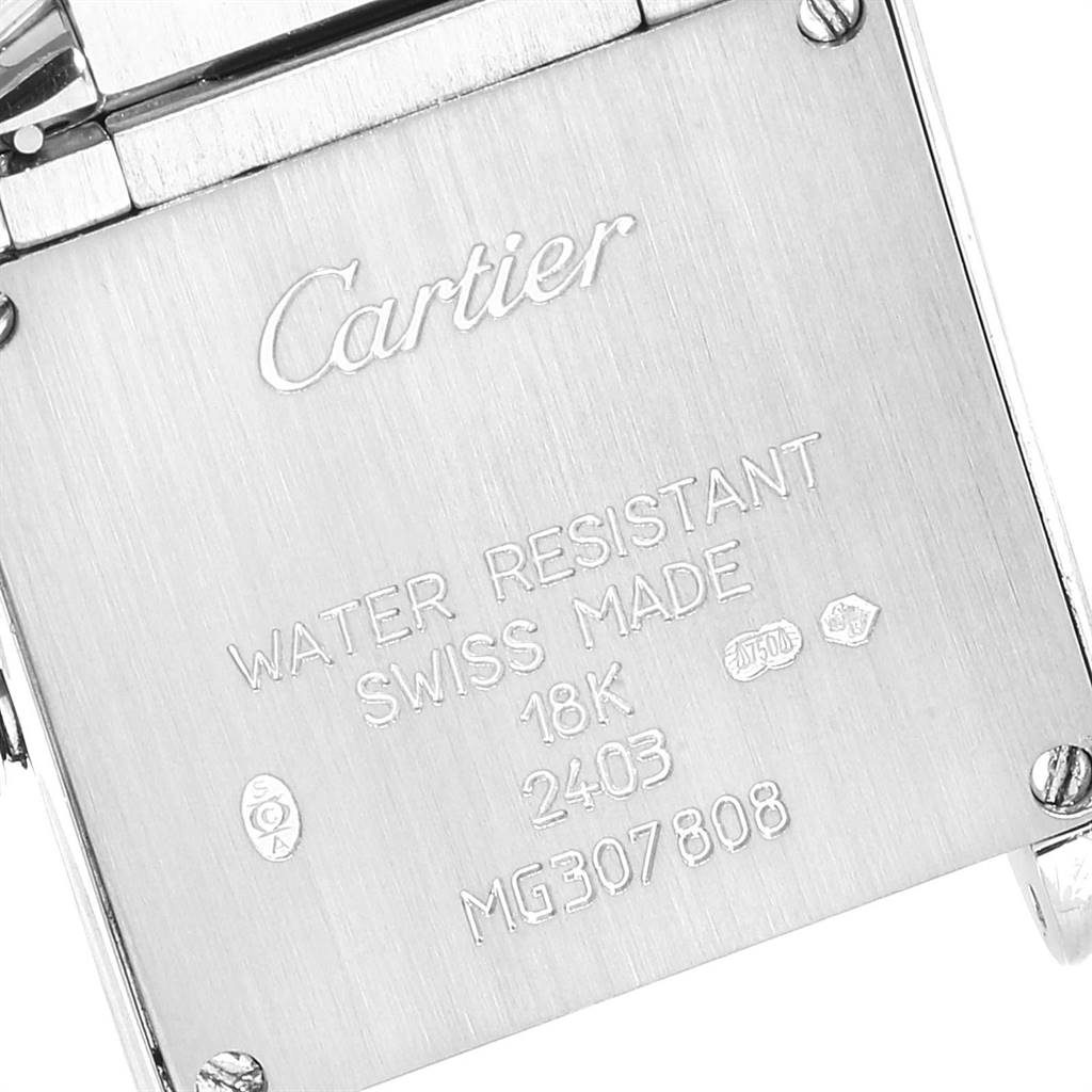This image shows the back of a Cartier Tank Francaise W50012S3 Women's White Gold Silver Dial W50012S3 Women's White Gold Silver Dial watch, highlighting engravings and details like "18K" and "Swiss Made."