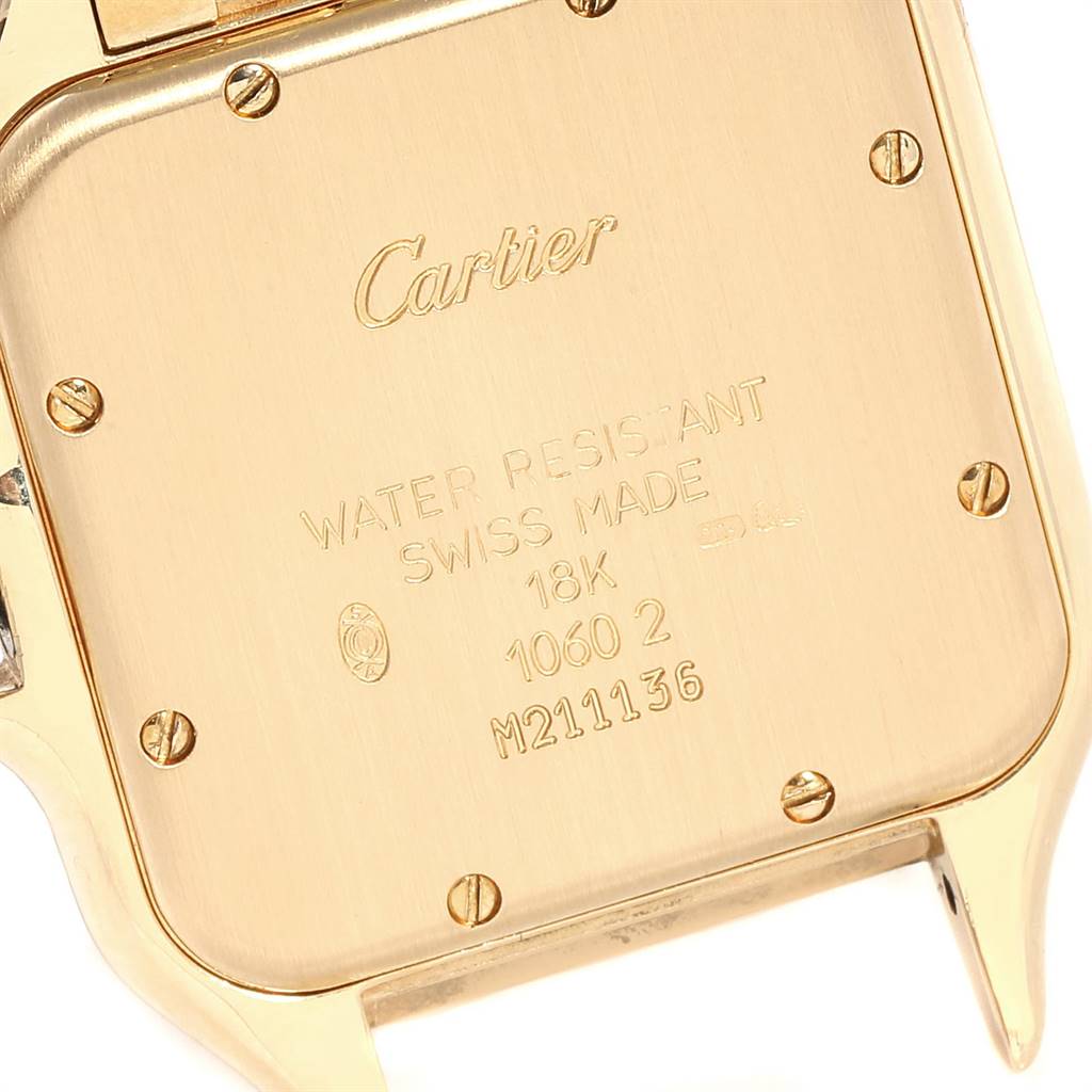 The image shows the backplate of a Cartier Tank Francaise W25014B9 Yellow Gold Silver Dial W25014B9 Yellow Gold Silver Dial watch, highlighting its engravings and screws.