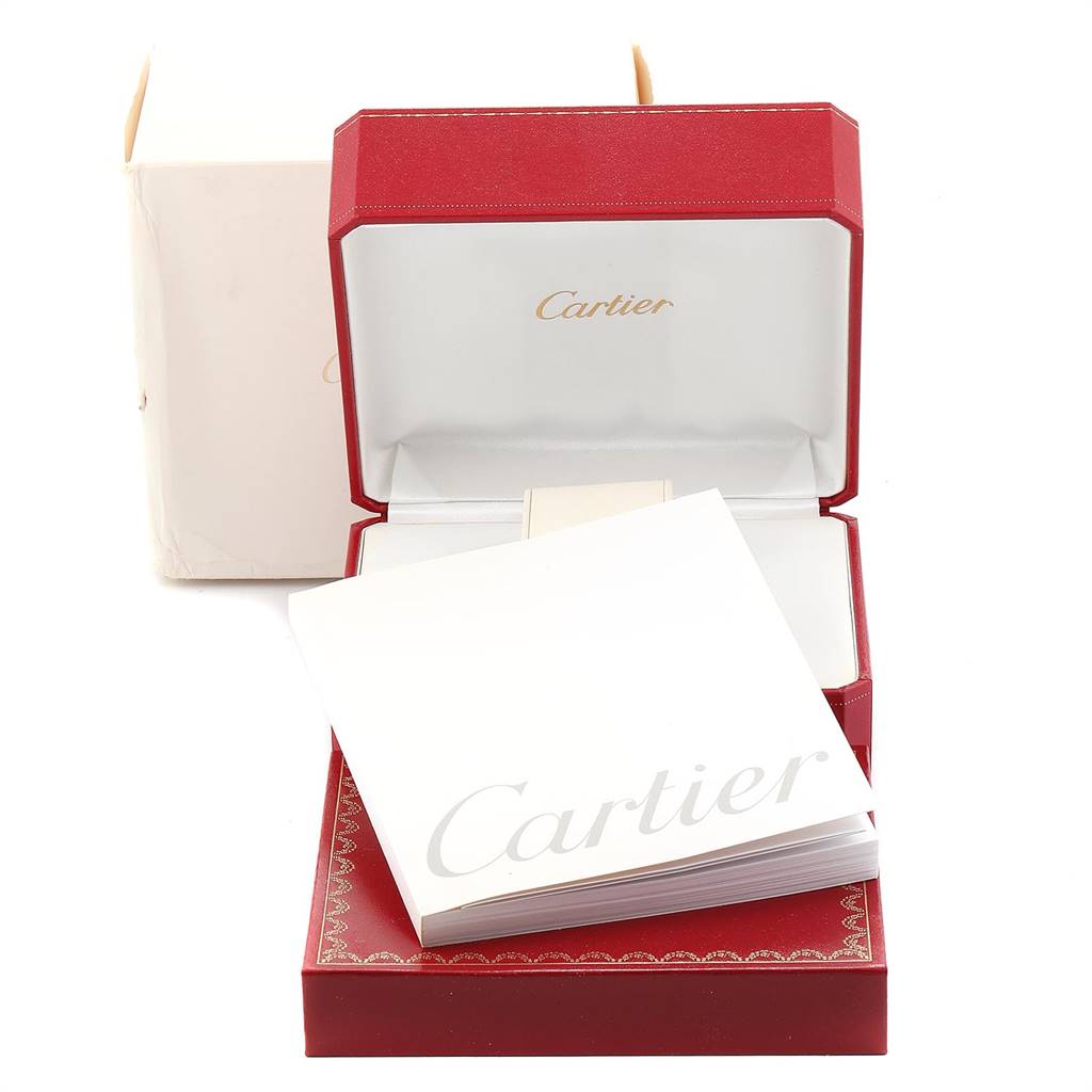 The image shows the packaging of a Tank Française model by Cartier, including a red box, papers, and an outer box.
