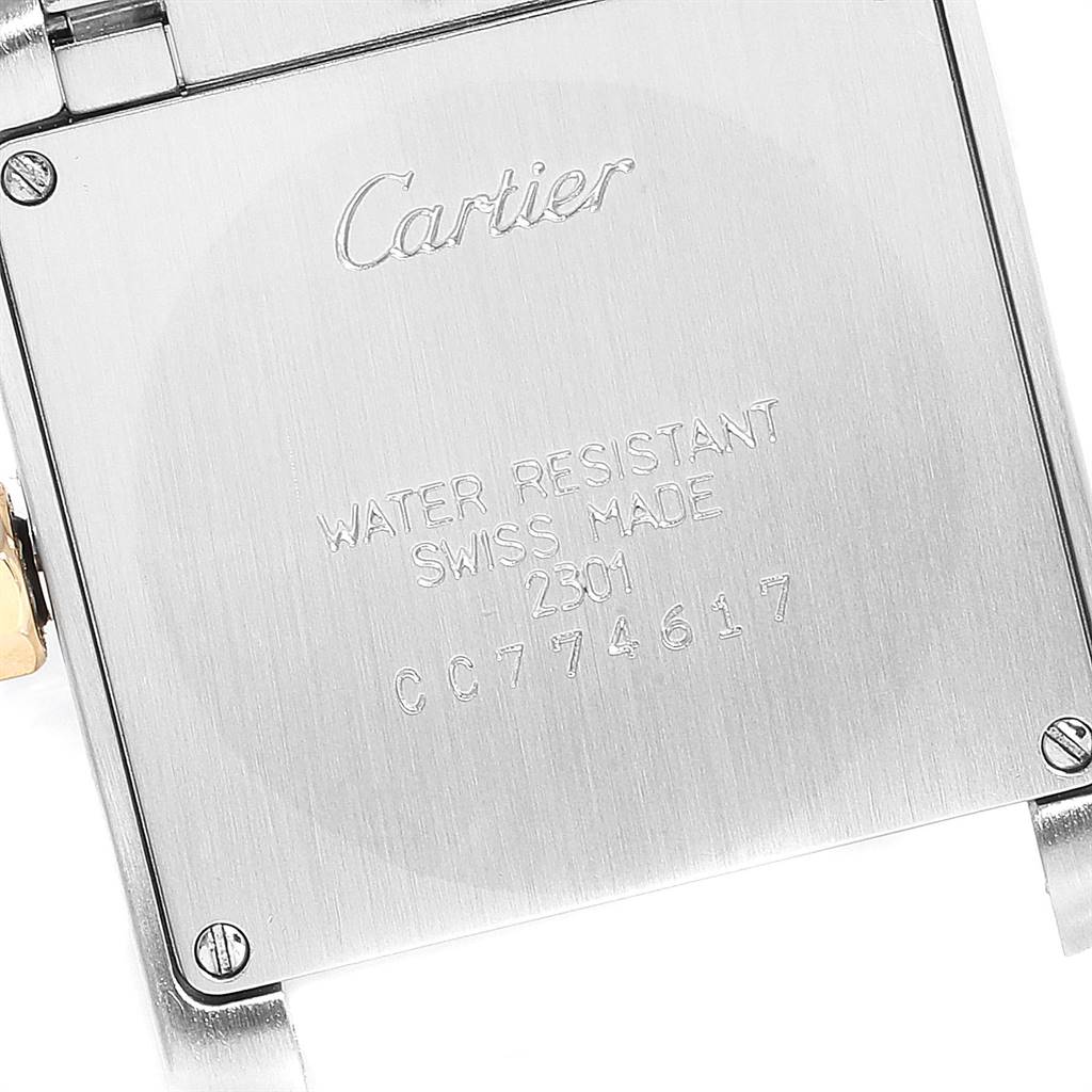 This is the back of a Cartier Tank Francaise W2TA0003 Women's Steel and Gold (two tone) Silver Dial W2TA0003 Women's Steel and Gold (two tone) Silver Dial watch, showcasing the brand name and model details.