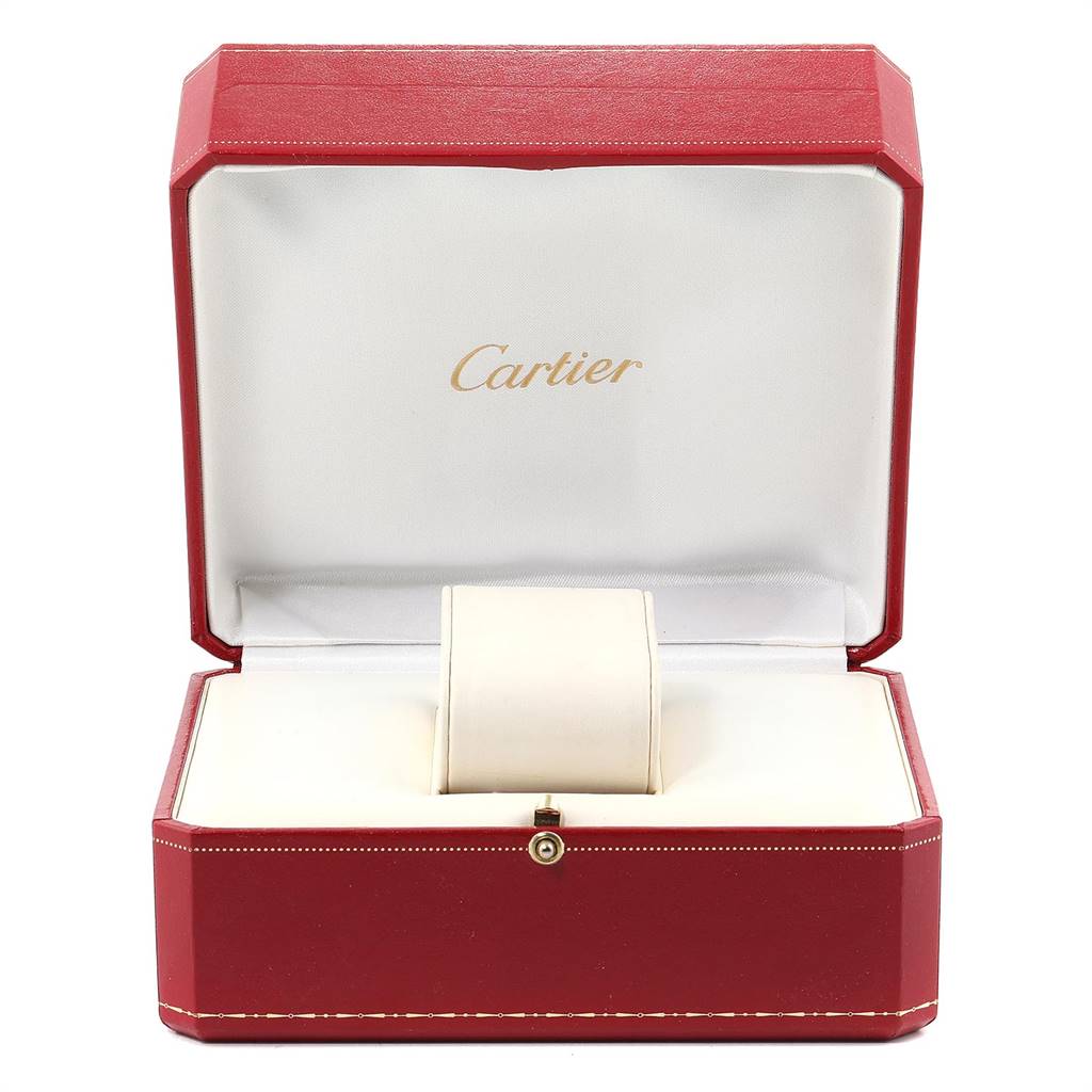 This image shows an open red Cartier watch box for the Tank Française model, with a cushioned holder inside.