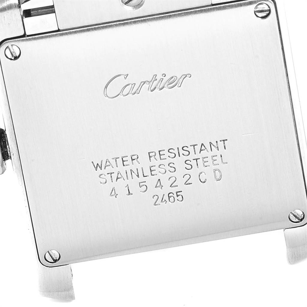 The image shows the back casing of the Cartier Tank Française watch, highlighting its engraving and screws.
