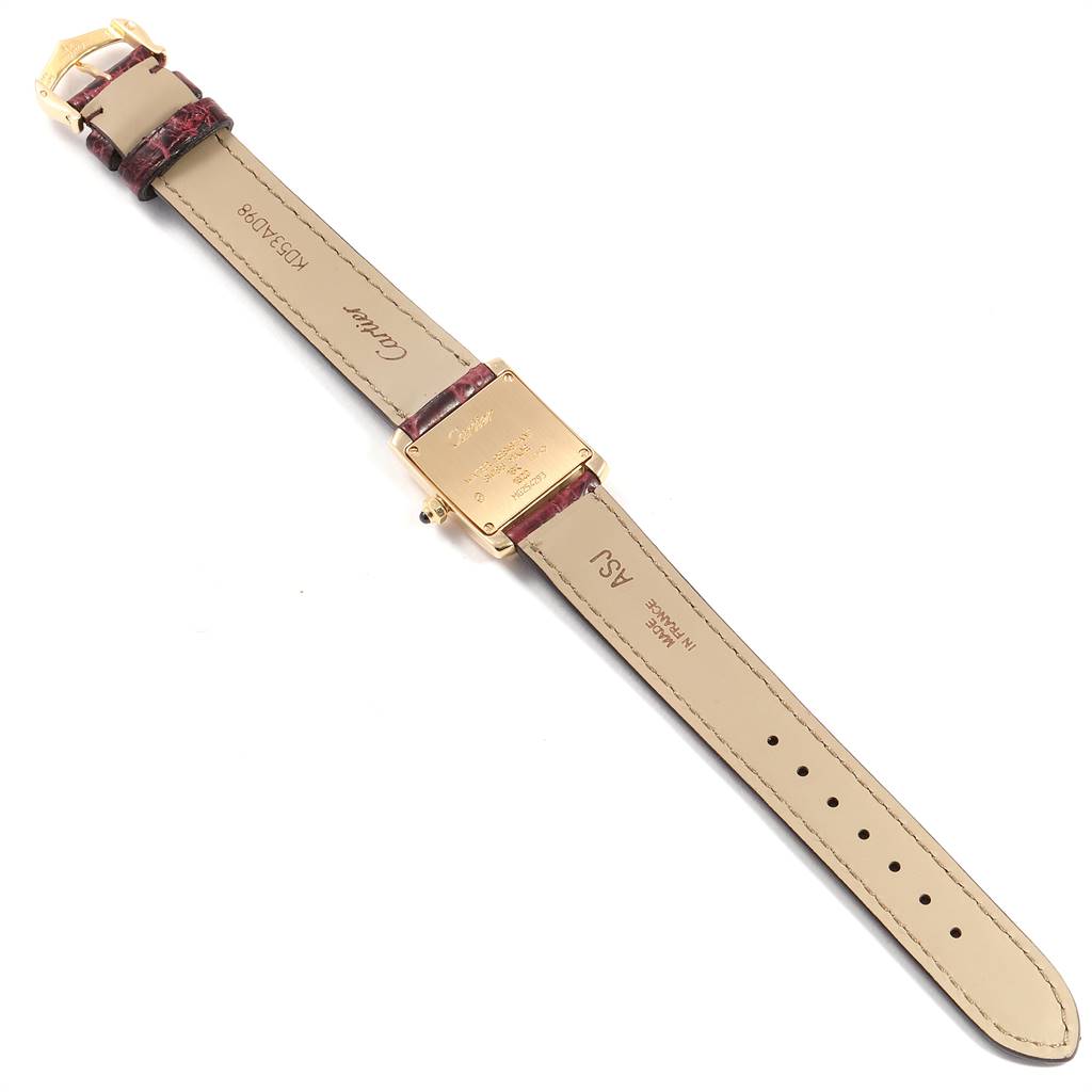 The image shows the back of the Cartier Tank Francaise W50002N2 Women's Yellow Gold Silver Dial W50002N2 Women's Yellow Gold Silver Dial watch, including its case back, straps, and buckle.