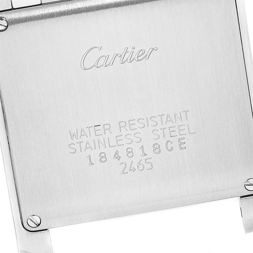 This image shows the backside of a Cartier Tank Française watch, highlighting its water resistance and stainless steel markings.