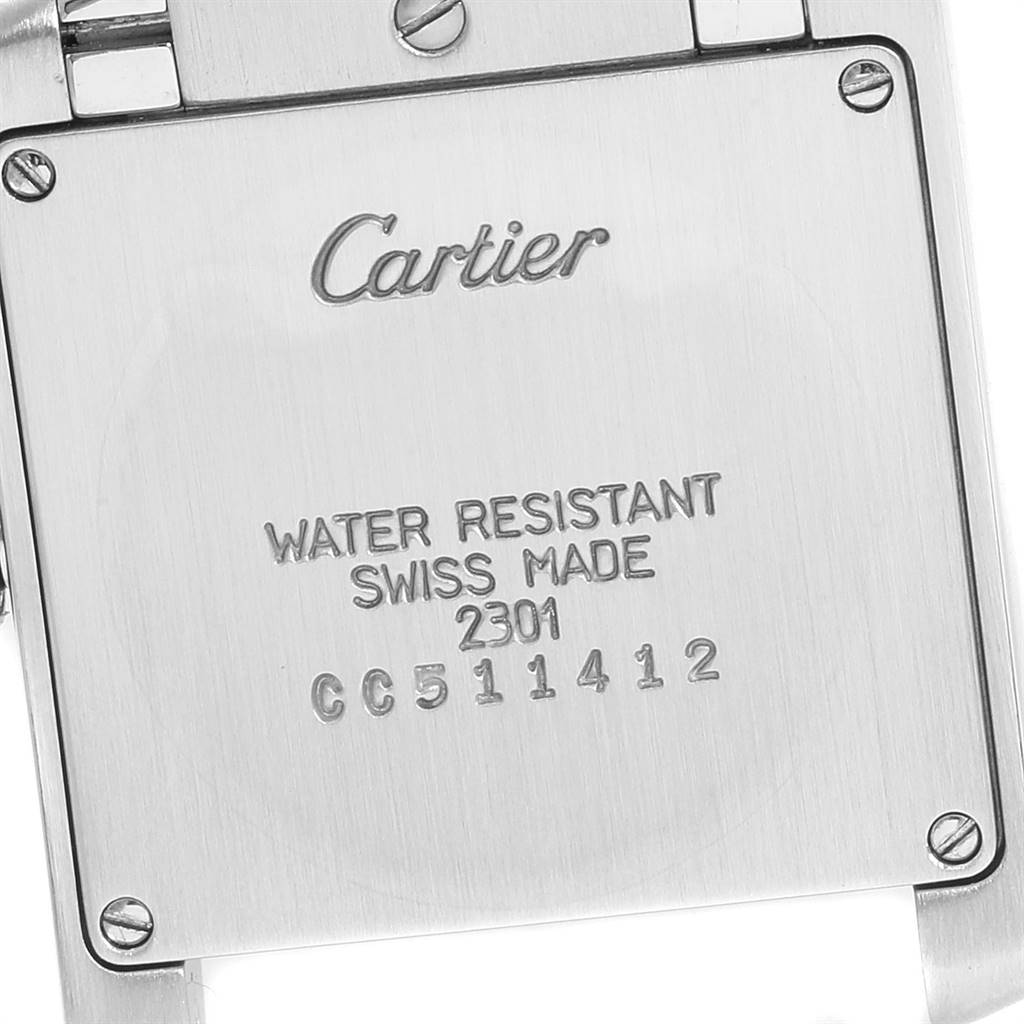 This image shows the back of a Cartier Tank Francaise W2TA0003 Women's Steel and Gold (two tone) Silver Dial W2TA0003 Women's Steel and Gold (two tone) Silver Dial watch, displaying the brand name, water resistance rating, and serial number.