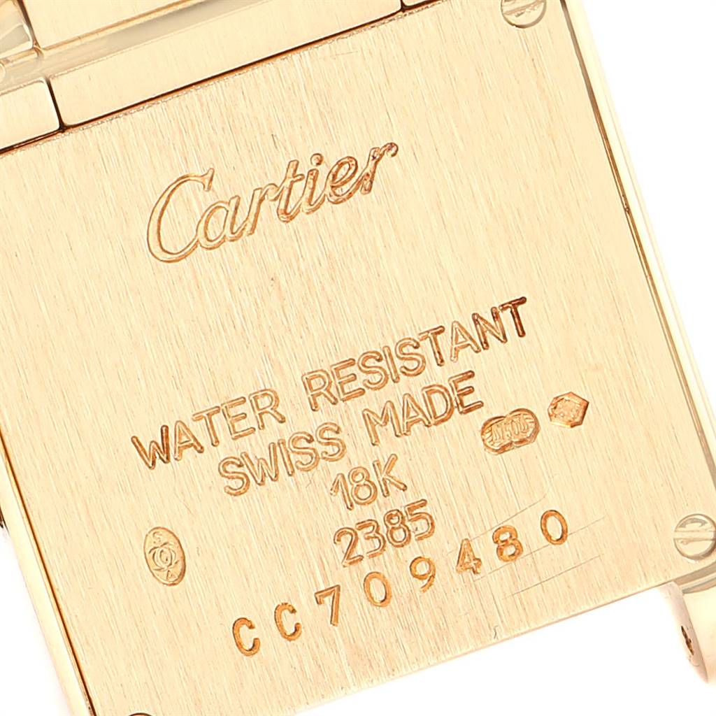 This image shows the back case of a Tank Francaise model by Cartier, highlighting its inscriptions and specifications.