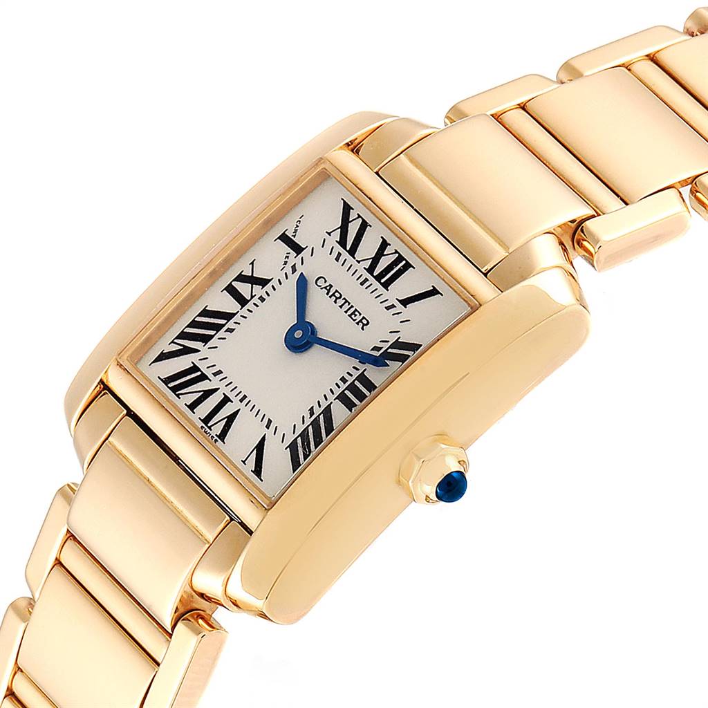 The Cartier Tank Francaise W50002N2 Women's Yellow Gold Silver Dial W50002N2 Women's Yellow Gold Silver Dial watch is shown at a slight angle showcasing the dial, bracelet, and crown with a blue cabochon.