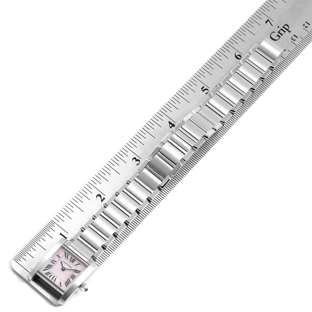 The image displays the face and bracelet of a Cartier Tank Francaise W51028Q3 Women
s Stainless Steel Mother of Pearl Dial W51028Q3 Women
s Stainless Steel Mother of Pearl Dial model, aligned with a ruler for measurement.