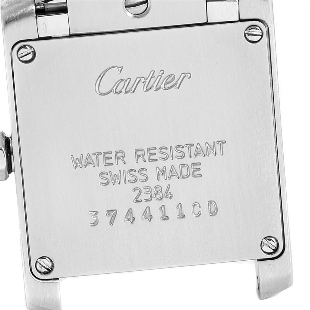 The image shows the back case of a Cartier Tank Française watch, displaying its water resistance and serial number details.