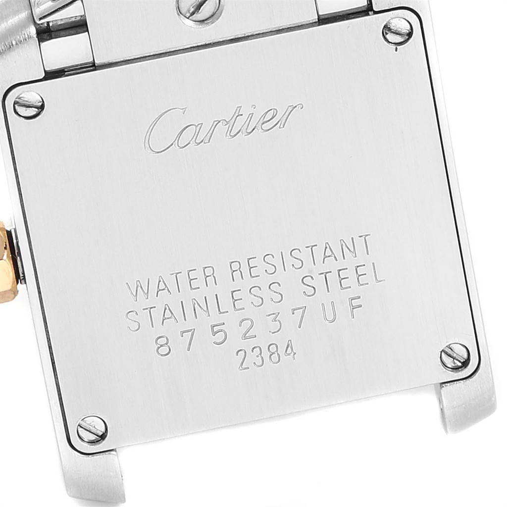  The image shows the case back of a Tank Francaise model watch by Cartier, highlighting its water resistance and serial numbers.
