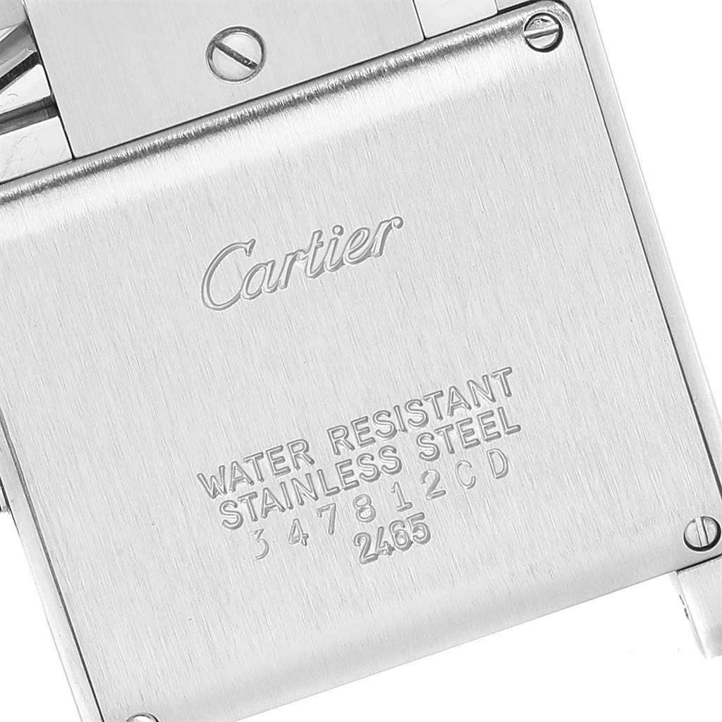 The image shows the back case of a Cartier Tank Francaise W51011Q3 Women
s Stainless Steel Silver Dial W51011Q3 Women
s Stainless Steel Silver Dial watch, featuring engraved branding and specifications.