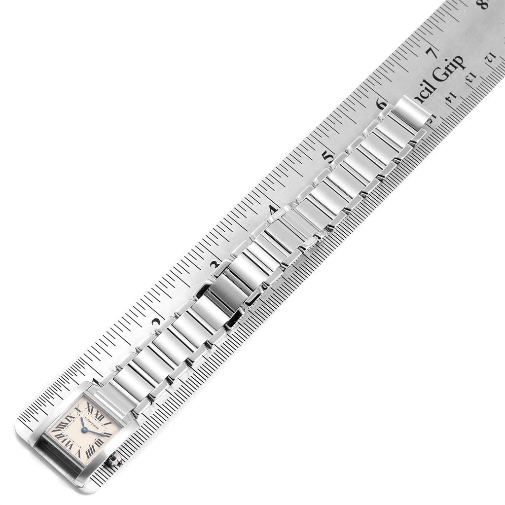 The image shows a Cartier Tank Francaise W51008Q3 Women
s Stainless Steel Silver Dial W51008Q3 Women
s Stainless Steel Silver Dial watch face and bracelet measured against a ruler.