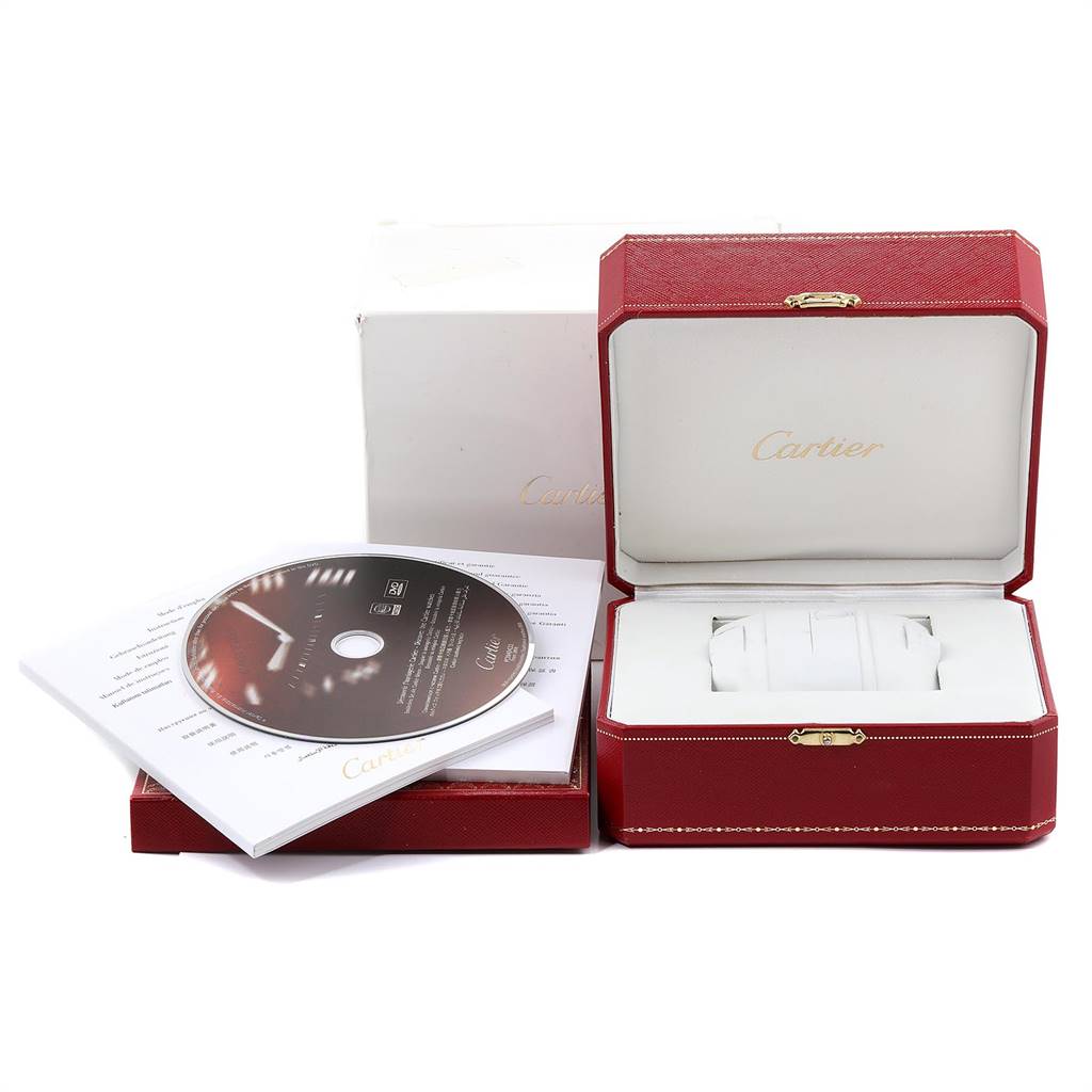 The image shows the packaging, including the red box, booklet, and CD, for the Cartier Tank Francaise W4TA0008 Women
s Stainless Steel Silver Dial W4TA0008 Women
s Stainless Steel Silver Dial model watch.