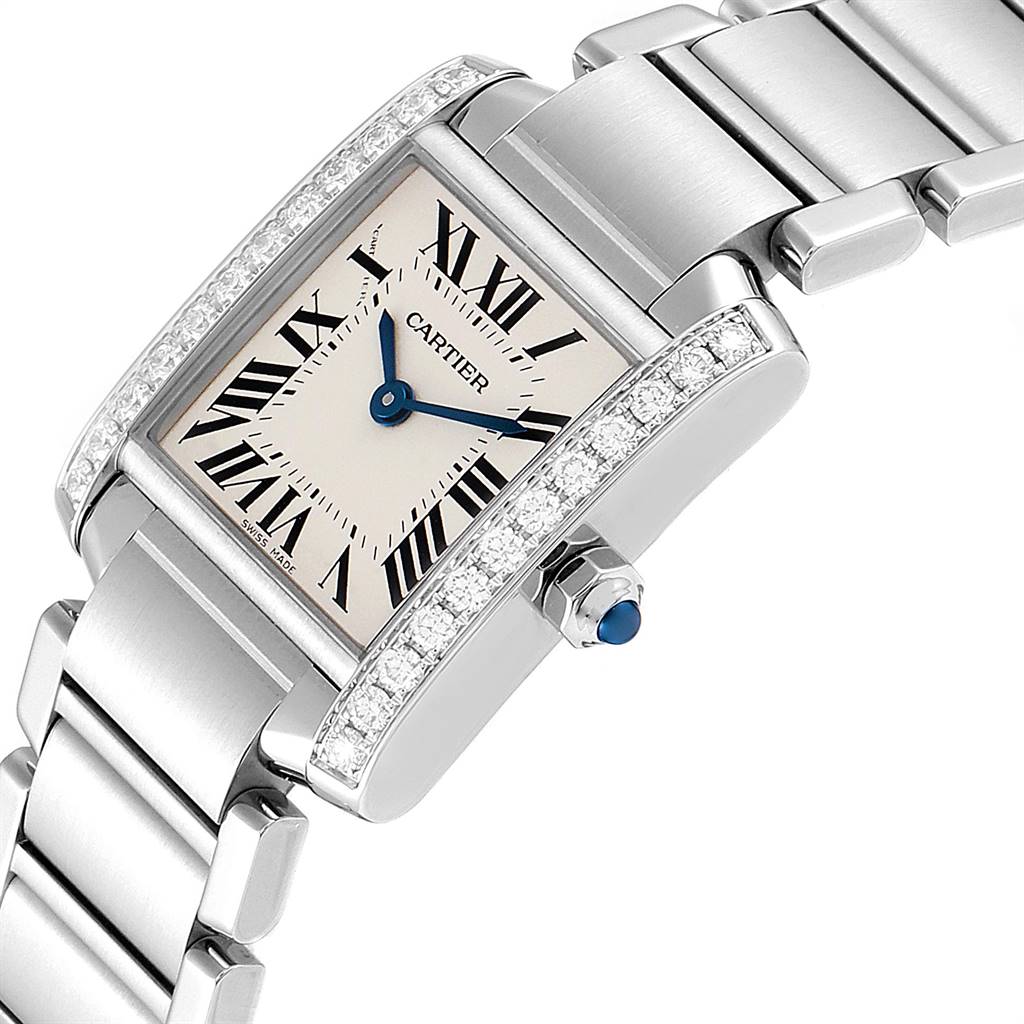 The image shows a Cartier Tank Française watch face and part of the metal bracelet, highlighting its Roman numeral dial and diamond-set bezel.