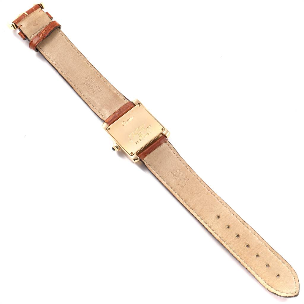 The image shows the back view of a Cartier Tank Française watch with its leather strap fully extended.