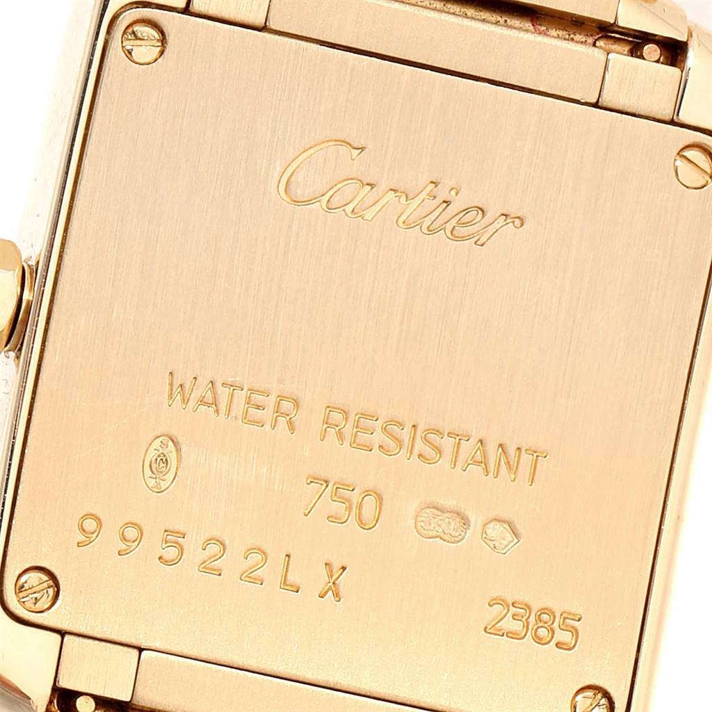 The image shows the case back of a Cartier Tank Francaise W50002N2 Women
s Yellow Gold Silver Dial W50002N2 Women
s Yellow Gold Silver Dial watch, displaying engravings including the brand, model details, and water resistance markings.