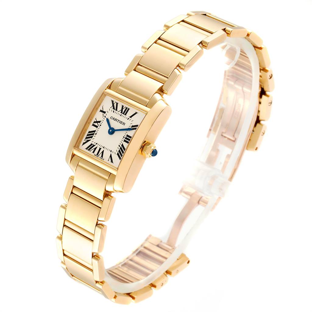 The image shows a Cartier Tank Française watch at a slight angle, displaying its gold case, bracelet, and face with Roman numerals.