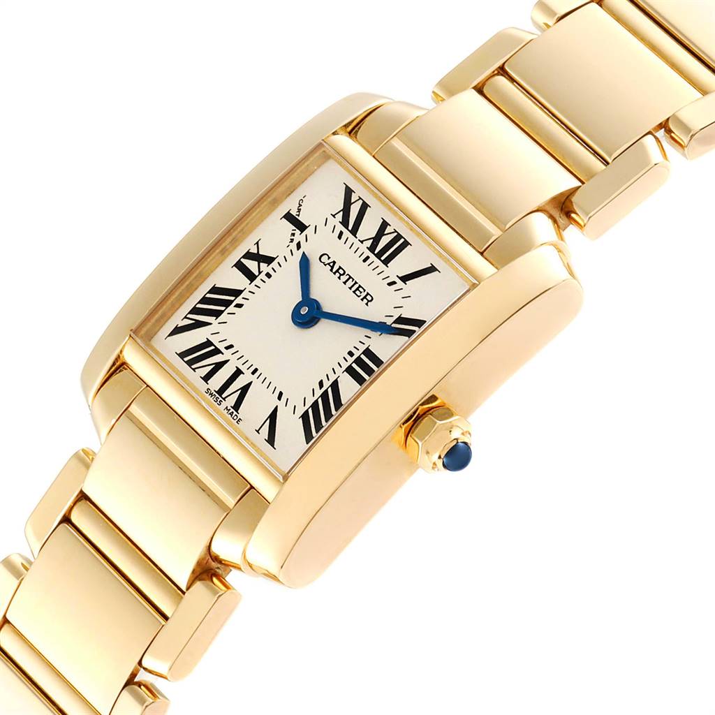This image shows a Cartier Tank Francaise W50002N2 Women
s Yellow Gold Silver Dial W50002N2 Women
s Yellow Gold Silver Dial watch at an angle highlighting its gold case, Roman numeral dial, and metallic strap.