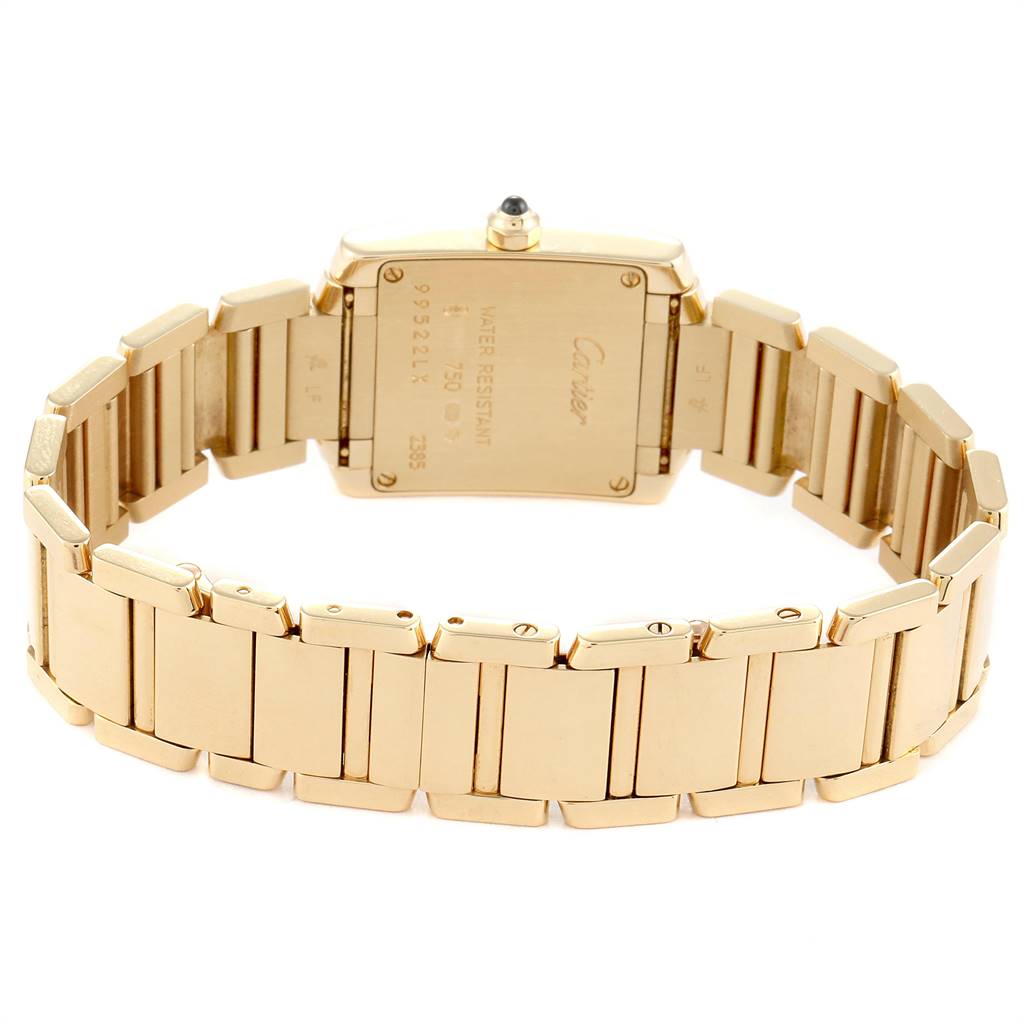 The image shows the back and bracelet of a gold Cartier Tank Francaise W50002N2 Women
s Yellow Gold Silver Dial W50002N2 Women
s Yellow Gold Silver Dial watch.