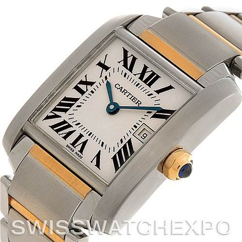 The image shows a close-up angle of a Cartier Tank Française watch face, highlighting the Roman numerals, blue hands, date window, and part of the metal bracelet.
