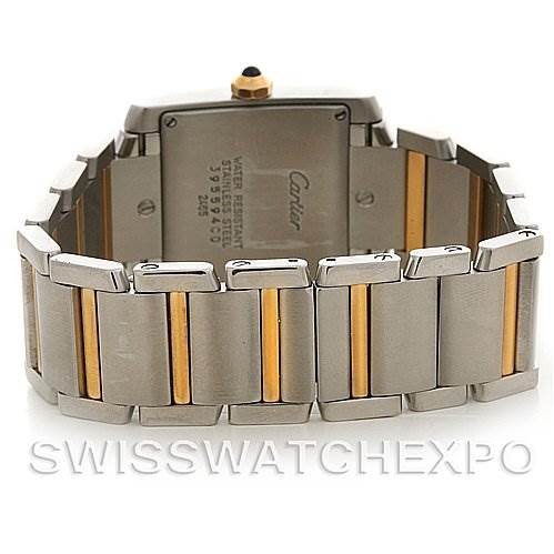 The image shows the back view of a Cartier Tank Francaise W51012Q4 Women's Steel and Gold (two tone) Silver Dial W51012Q4 Women's Steel and Gold (two tone) Silver Dial watch, focusing on the case back and two-tone metal bracelet.