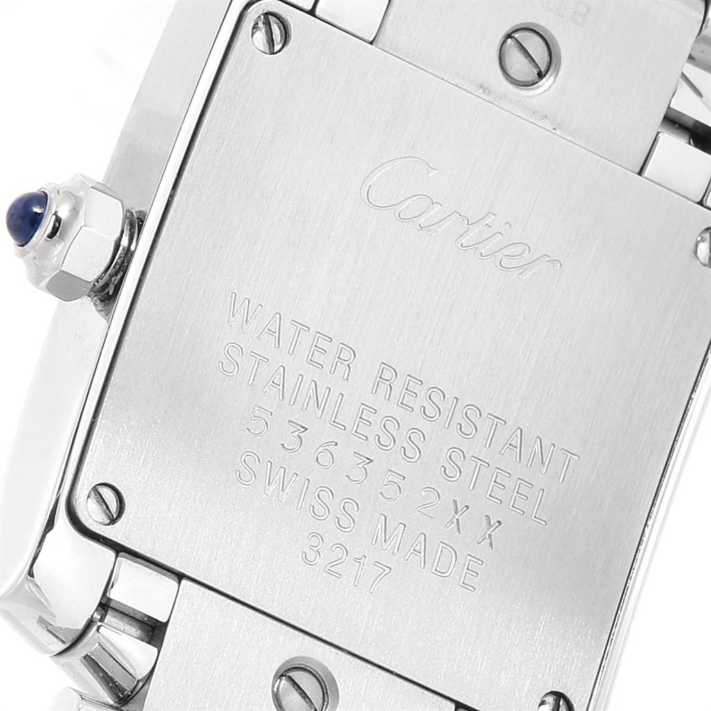 The image shows the back side of a Cartier Tank Francaise W4TA0008 Women
s Stainless Steel Silver Dial W4TA0008 Women
s Stainless Steel Silver Dial watch, highlighting the case back and the crown with a blue cabochon.