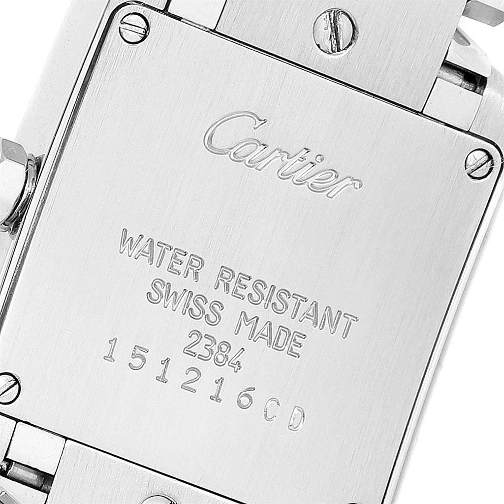 This image shows the stainless steel case back of a Cartier Tank Française model watch.