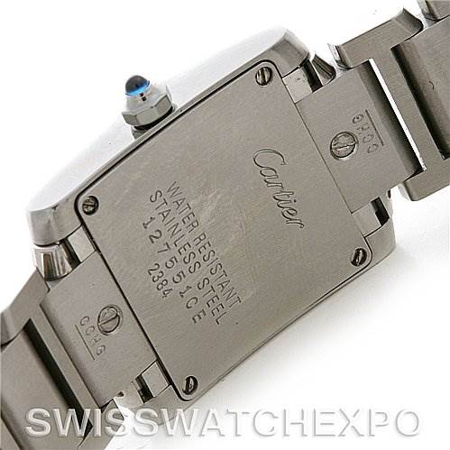 This image shows the back case and part of the stainless steel bracelet of a Cartier Tank Française watch.