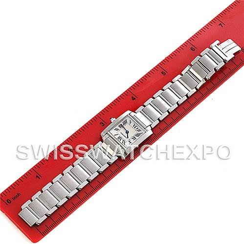 The image shows a Cartier Tank Francaise W51008Q3 Women's Stainless Steel White Dial W51008Q3 Women's Stainless Steel White Dial watch placed flat next to a red ruler, showcasing its bracelet and rectangular face.