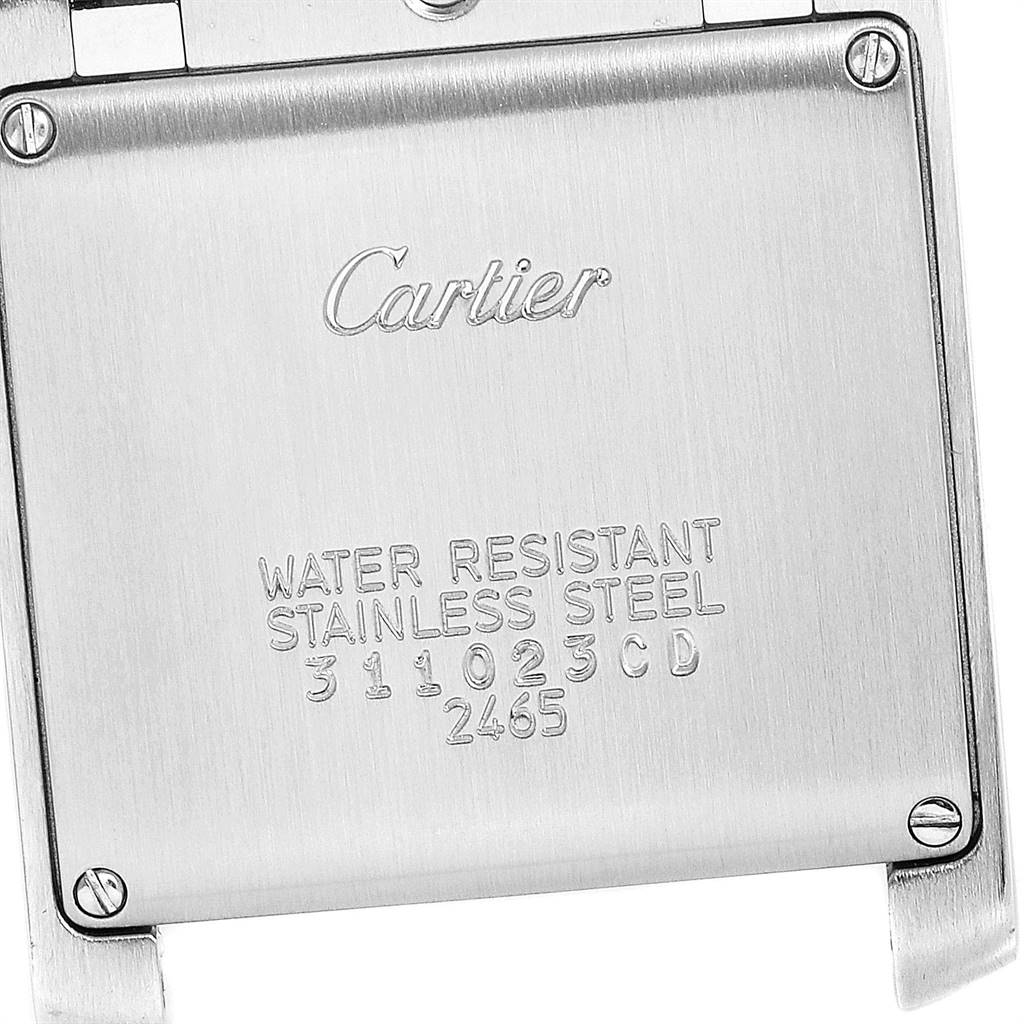 This image shows the back case of a Cartier Tank Francaise W51011Q3 Stainless Steel Silver Dial W51011Q3 Stainless Steel Silver Dial watch, highlighting engravings and screws.