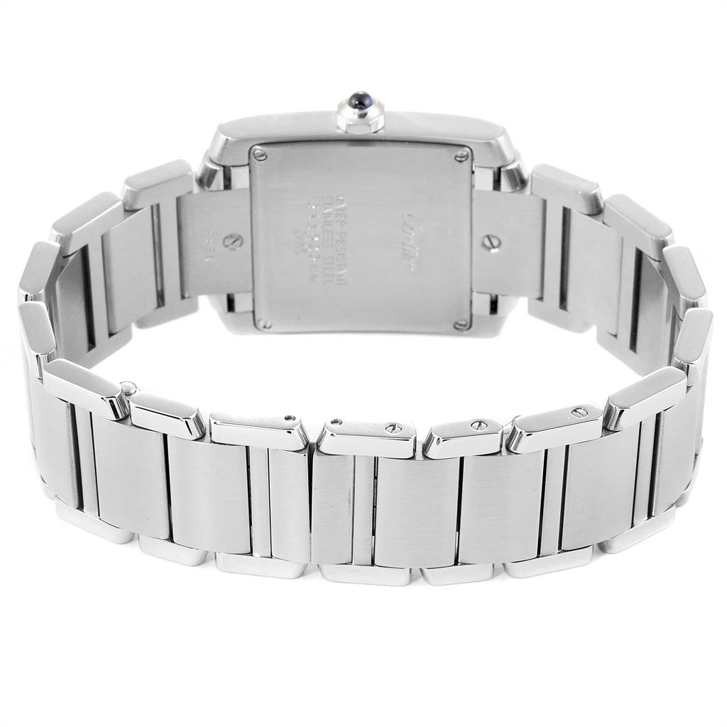 The image shows the back view of the Cartier Tank Française watch, highlighting the case back and stainless steel bracelet.