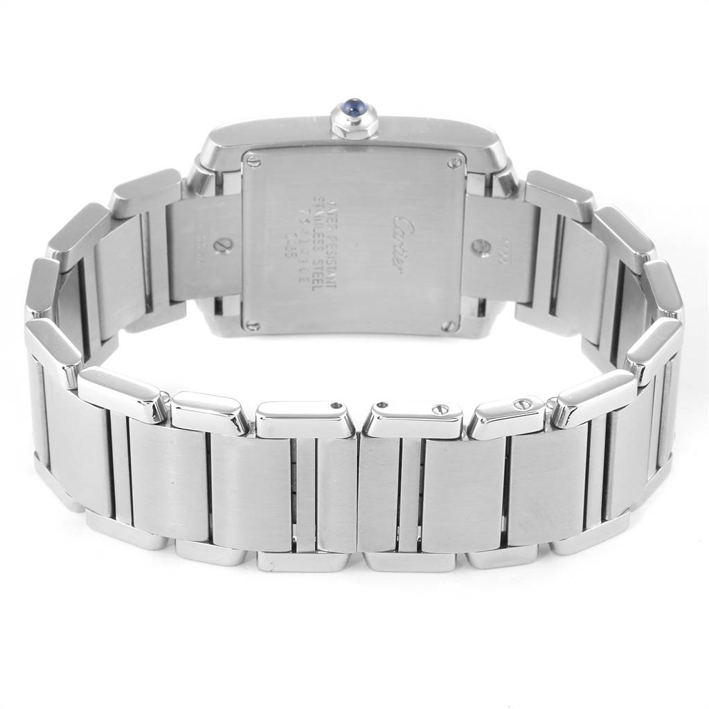 The image shows the backside of a Cartier Tank Francaise W51011Q3 Women
s Stainless Steel Silver Dial W51011Q3 Women
s Stainless Steel Silver Dial watch, highlighting its stainless steel bracelet and case.