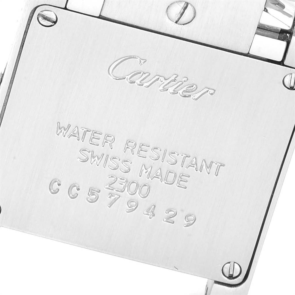The image shows a close-up of the back case of a Cartier Tank Francaise W51008Q3 Women
s Stainless Steel Silver Dial W51008Q3 Women
s Stainless Steel Silver Dial watch with engraved details.