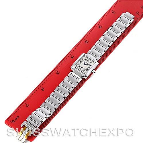 The image shows a Cartier Tank Francaise W51008Q3 Women's Stainless Steel White Dial W51008Q3 Women's Stainless Steel White Dial watch laid flat against a red ruler, displaying the face and bracelet.