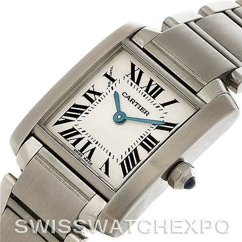 This image shows a close-up of the Cartier Tank Française watch, highlighting the face, bezel, bracelet, and crown with blue cabochon.