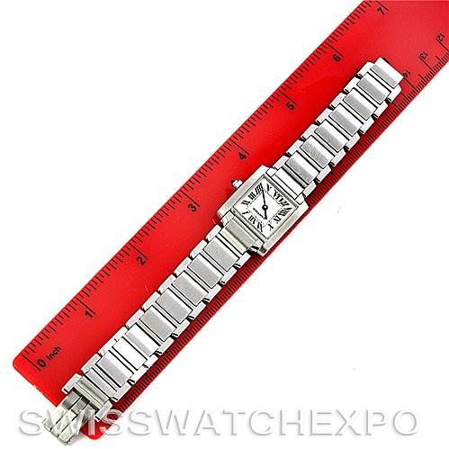 The Cartier Tank Francaise W51008Q3 Women's Stainless Steel White Dial W51008Q3 Women's Stainless Steel White Dial watch is shown laid flat with its stainless steel bracelet and square face displayed next to a ruler for scale.