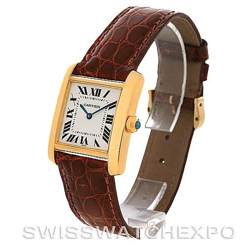 The image shows a Cartier Tank Francaise Women's Yellow Gold Silver Dial Women's Yellow Gold Silver Dial watch at an angle, highlighting its gold case, brown leather strap, and Roman numeral dial.