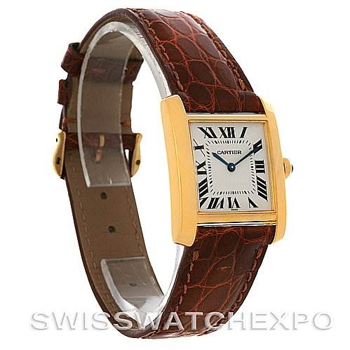 This image shows a side angle of the Cartier Tank Francaise Women's Yellow Gold Silver Dial Women's Yellow Gold Silver Dial watch, highlighting its gold case, leather strap, and Roman numeral dial.
