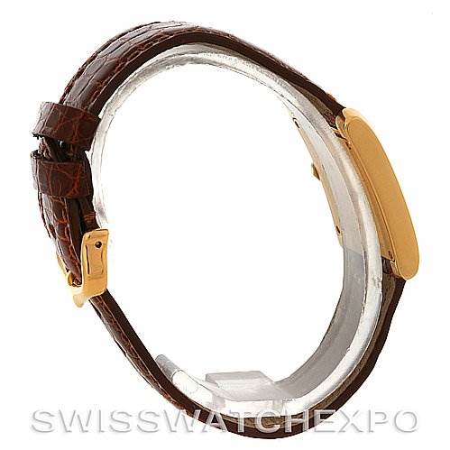 The image shows a side view of the Cartier Tank Francaise Women's Yellow Gold Silver Dial Women's Yellow Gold Silver Dial watch, highlighting its brown leather strap and gold case.