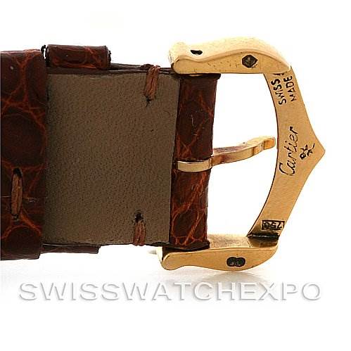 The image shows the clasp and part of the leather strap of a Cartier Tank Française watch at an angle that highlights the buckle.