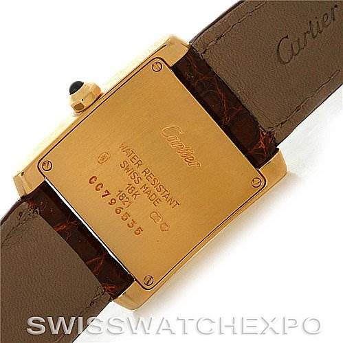 This image shows the back of a Cartier Tank Francaise Women's Yellow Gold Silver Dial Women's Yellow Gold Silver Dial watch, highlighting the back case and leather strap.