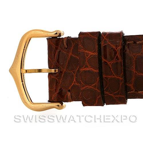 The image shows a close-up of a leather strap and gold buckle of a Cartier Tank Francaise Women's Yellow Gold Silver Dial Women's Yellow Gold Silver Dial watch.