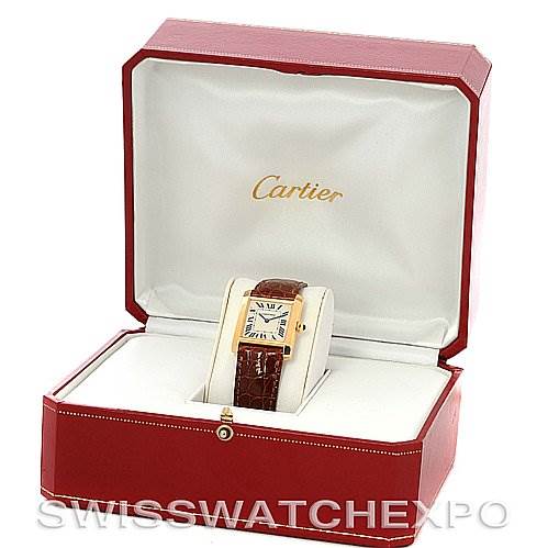 The image shows a Cartier Tank Francaise Women's Yellow Gold Silver Dial Women's Yellow Gold Silver Dial watch placed at an angle, displayed in an open red Cartier box with a white interior.