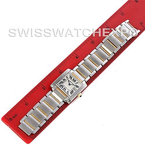 This top-down view shows the Cartier Tank Francaise W51012Q4 Women's Steel and Gold (two tone) Silver Dial W51012Q4 Women's Steel and Gold (two tone) Silver Dial watch laid flat next to a ruler for size reference.